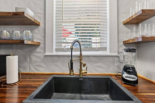 a kitchen counter with a sink and a window at The Luxe Hot Tub Private Bar 12 Min to Horse Park in Georgetown