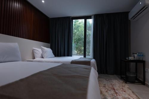 Cama o camas de una habitación en New Pyramid Front Hotel