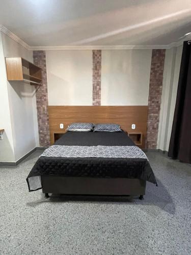 Postel nebo postele na pokoji v ubytování Loft Moderno no Centro