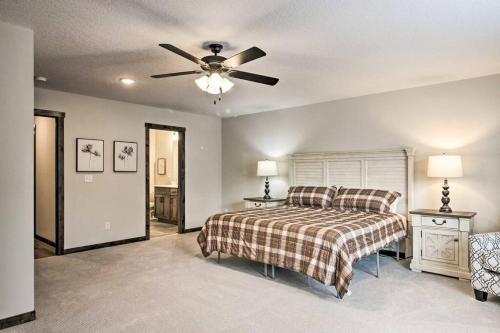 a bedroom with a bed and a ceiling fan at New Gull Lake Townhome! 5 bed 3200ft and Boat Slip in Nisswa