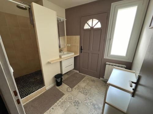 a bathroom with a shower and a sink and a mirror at Gîte - Comme à la maison in Saint-Martin-la-Rivière