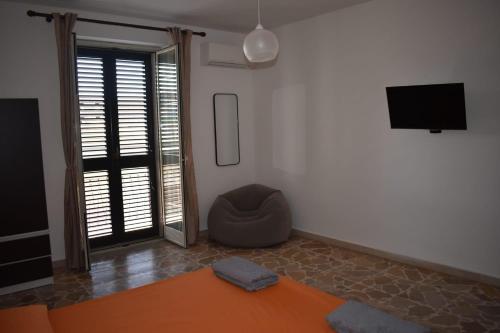 TV a/nebo společenská místnost v ubytování La casa di Nerone