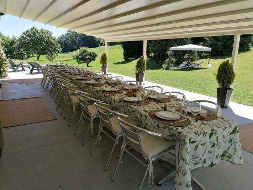 a long table set up for a wedding reception at Antica Cascina del Medico in Muzzano