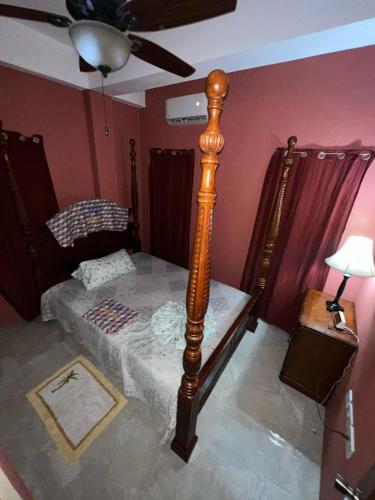 a bedroom with two beds and a ceiling fan at Desired View vacation rentals in LʼIvrogne