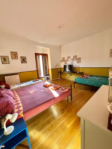 a bedroom with a large bed in a room at Harry Potter House - 10 min to Centrale in Milan