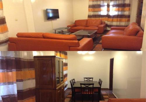 a living room with a couch and a table at La Belle maison in Dakar
