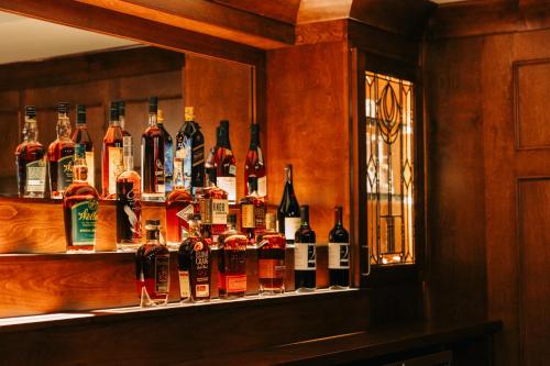 a shelf with a bunch of bottles of alcohol at The St. Clair in Frankfort
