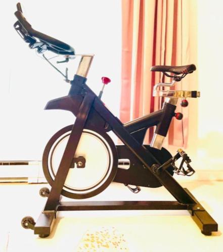 a bike on a stand in a room at Guest Favorite Garuda Apartment 8 in Shandaken