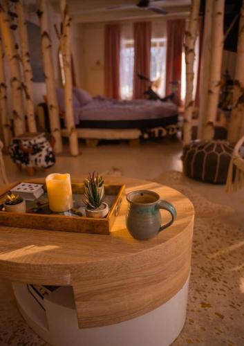 a living room with a table with a tray of cheese at Guest Favorite Garuda Apartment 8 in Shandaken