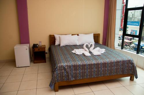 Кровать или кровати в номере Hotel Jhor Bush