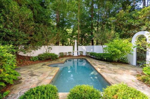 a swimming pool in the middle of a yard at 11580sqft Large Home By Airport in Atlanta