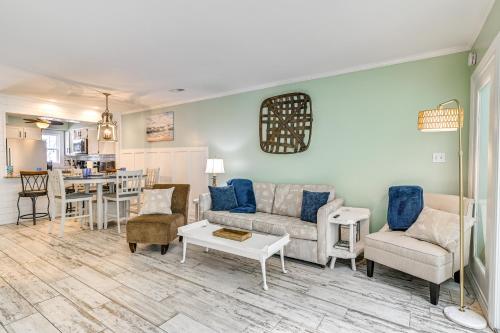 a living room with a couch and a table at Chic Murrells Inlet Getaway about 2 Mi to Marsh Walk! in Myrtle Beach