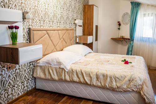 Postel nebo postele na pokoji v ubytování Enika Hotel