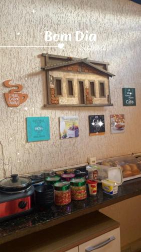 a counter with jars of food on top of it at La Luna dos Pireneus - Pousada in Pirenópolis