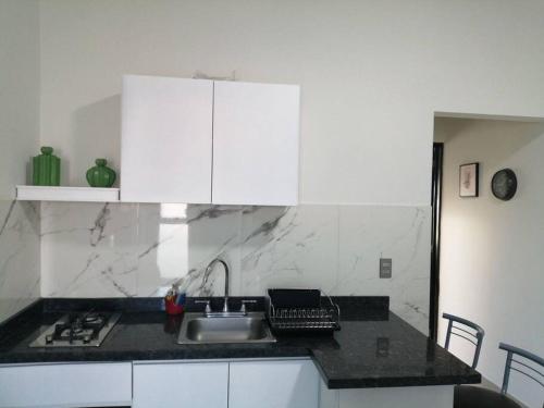 a kitchen with a sink and a counter top at Departamento Ciudad del Valle B in Tepic