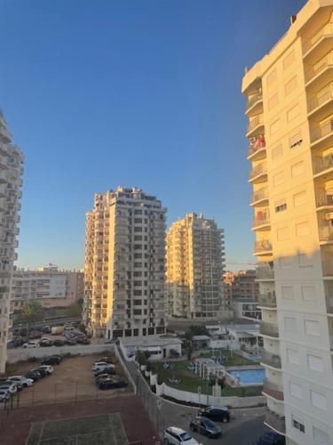 a view of a city with tall buildings at Apartamento ARMAÇÃO PÊRA in Armação de Pêra