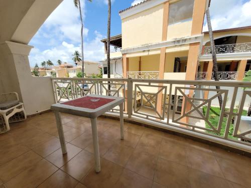 a table on the balcony of a building at El Dorado Condo 201A in Punta Cana