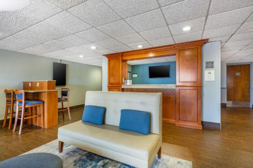 a living room with a couch and a table at Best Western Port Clinton in Port Clinton