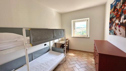 Postel nebo postele na pokoji v ubytování S214 - Sirolo, trilocale con giardino in zona tranquilla