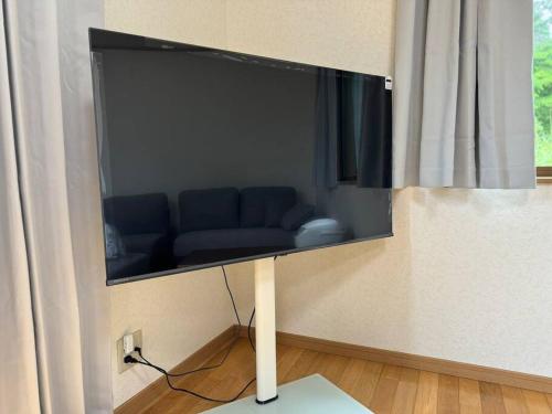 a flat screen tv hanging on a wall at ENOKIYA Nikko in Nikko