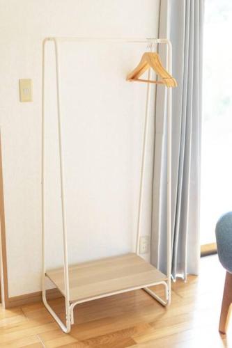 a white swing in a room next to a window at ENOKIYA Nikko in Nikko