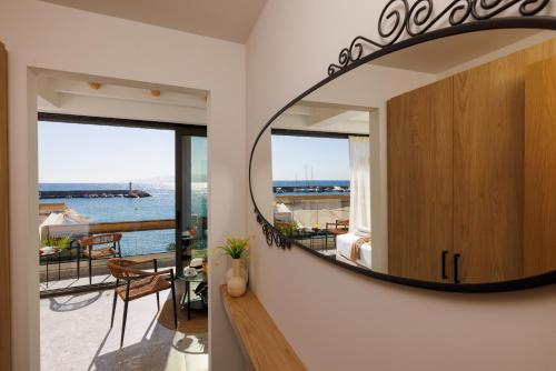 a room with a large mirror on the wall at Soho SeaFront Suites in Hersonissos