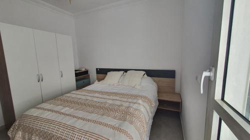 Una cama o camas en una habitación de Agadir Anza plage