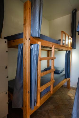 a pair of bunk beds in a room at Take it Easy Hostel in Florianópolis