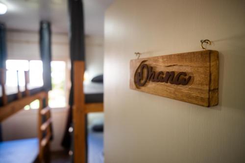 a sign that reads wrong hanging on a wall at Take it Easy Hostel in Florianópolis