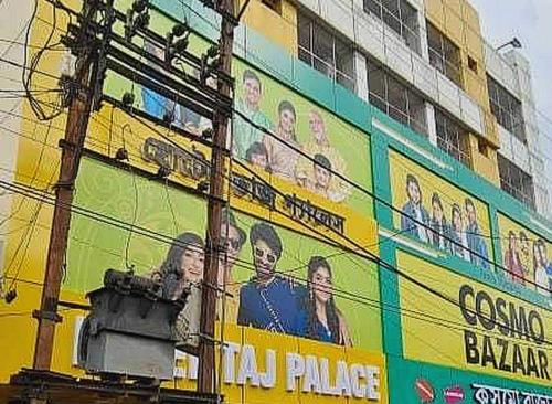 a building with an advertisement on the side of it at Hotel O Taj Palace in Tarapith