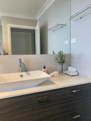 a bathroom with a sink and a mirror at Tranquility in Oberon