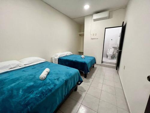 Ένα ή περισσότερα κρεβάτια σε δωμάτιο στο Departamento Vacacional