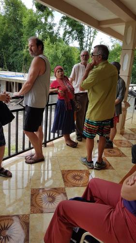 a group of people standing on a porch at New Bintang By Four-G in Bajawa