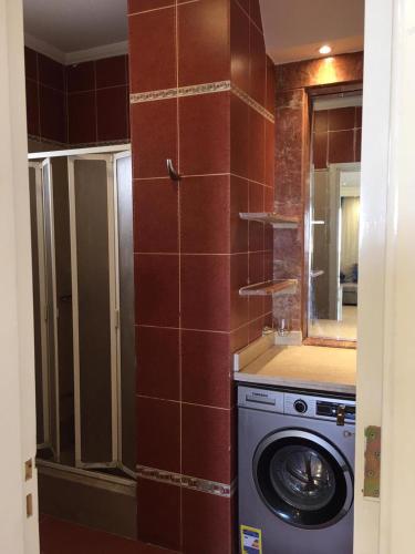 a kitchen with a washing machine in a room at Tallinn Travel in Sharm El Sheikh