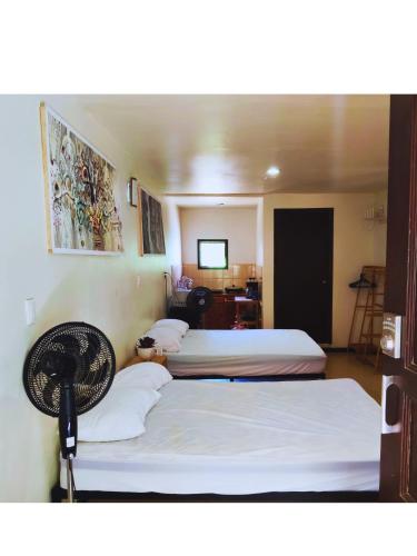 Giường trong phòng chung tại Casa NAU Mazunte