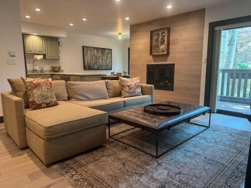 a living room with a couch and a coffee table at 3Bdr in the heart of lions head Ski locker in Vail