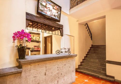 a bar with a bike on the counter in a building at Hotel Templo Mayor in Mexico City