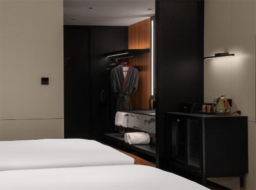 Ένα ή περισσότερα κρεβάτια σε δωμάτιο στο Intercity Hotel Guangzhou South Railway Station - Free Minibar including Erdinger Weissbier