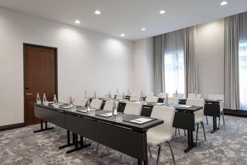 a large meeting room with a long table and chairs at Hotel Ivy, a Luxury Collection Hotel, Minneapolis in Minneapolis