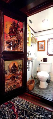 a bathroom with a toilet and a sink at Sabai Sabai Liveaboard Bangkok in Bangkok