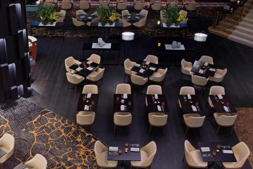 an overhead view of a restaurant with tables and chairs at Sydney Harbour Marriott Hotel at Circular Quay in Sydney