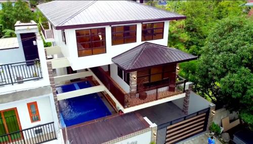 an aerial view of a house with a swimming pool at Casa Florida Private Resort - Calamba in Calamba