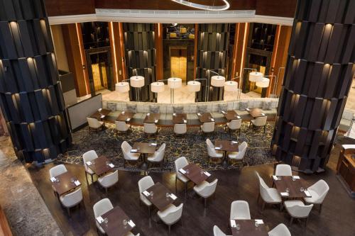 an overhead view of a restaurant with tables and chairs at Sydney Harbour Marriott Hotel at Circular Quay in Sydney