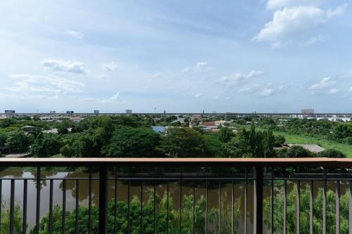 a view of a city from a balcony at Courtyard by Marriott Bangkok Suvarnabhumi Airport in Lat Krabang