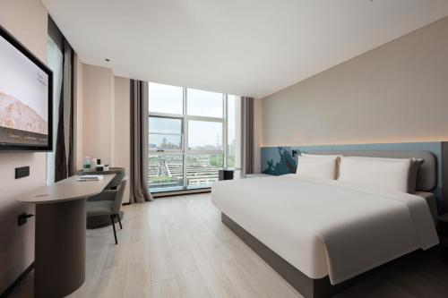Ένα ή περισσότερα κρεβάτια σε δωμάτιο στο Atour Light Hotel Hangzhou Gongshu Grand Canal