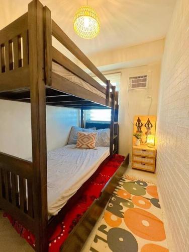 a bedroom with a bunk bed in a room at Happy Nest at La Bella Condo Banilad Mandaue Cebu 2 Bedrm Free wifi 6pax max in Banilad