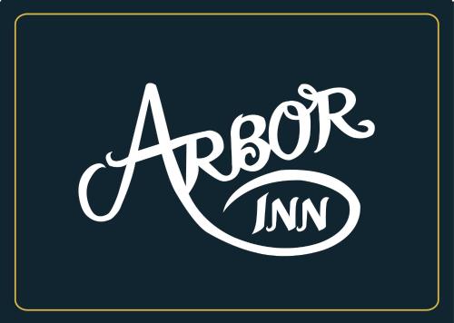 a logo for an amazon inc company in white at Arbor Inn Monterey in Monterey