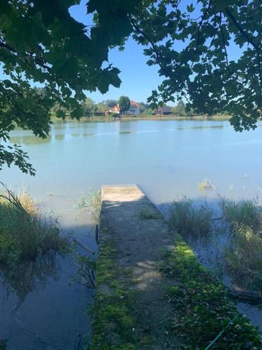 a body of water with a dock in the middle at Appartement Nähe Zentrum Steyr in Behamberg
