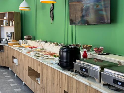 a buffet line with many different types of food at Royal Sebzor Hotel in Tashkent