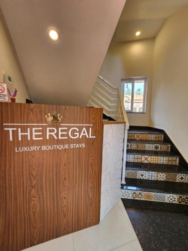 a store with a sign that reads the retail luxury boutique stays at The Regal Luxury Boutique Stays in Majorda